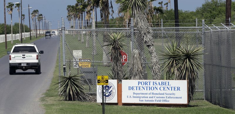 FILE - In this June 26, 2018, file photo, a U.S. Border Patrol truck enters the Port Isabel Detention Center, which holds detainees of the U.S. Immigration and Customs Enforcement, in Los Fresnos, Texas. Parents who have been separated from their children at the border are in fragile state of mind as they go into high-stakes initial screening interview for asylum. A network of volunteer lawyers has counseled about 210 separated parents at Port Isabel Detention Facility, including about 150 who have already done initial interviews. (AP Photo/David J. Phillip, File)