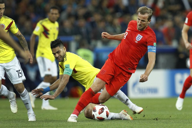 The Associated Press KANE STANDS OUT: England's Harry Kane, right, battles for the ball with Colombia's Radamel Falcao during the round of 16 match between Colombia and England at the 2018 World Cup in Spartak Stadium, in Moscow, Russia, Tuesday. Kane is among several players that are possibly in contention for the title of soccer's best player since Argentina's Lionel Messi and Portugal's Christano Ronaldo saw early exits from this year's World Cup.