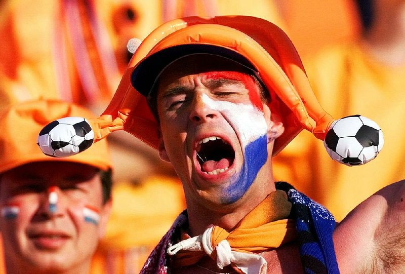 A Dutch soccer fan reacts with unbounded joy as his team scores against Sweden last October. The Netherlands won 2-0, but was shut out of the World Cup on complicated qualifying points. Fayetteville-born Otus the Head Cat’s award-winning column of humorous fabrication appears every Saturday.
