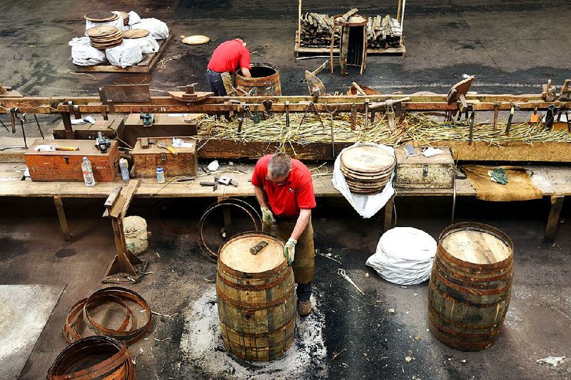 Workers at Scotland's Speyside Cooperage fashion oak casks for aging Scotch whisky.