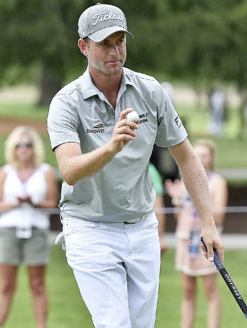 Webb Simpson waves to the crowd after making birdie on No. 11 during the first round of the A Military Tribute golf tournament at The Greenbrier on Thursday, July 5, 2018, in White Sulphur Springs, W.Va.