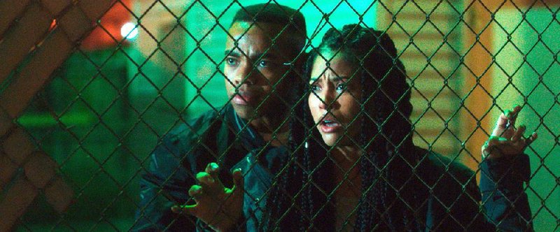 Isaiah (Joivan Wade) and Nya (Lex Scott Davis) try to survive 12 hours of Staten Island lawlessness in Gerard McMurray’s The First Purge. 
