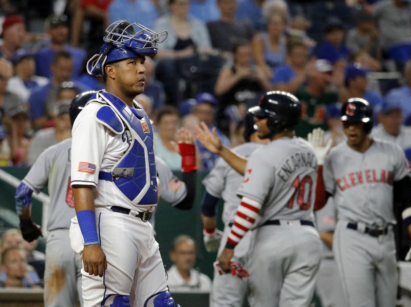 The Associated Press WRONG-WAY ROYALS: Kansas City Royals catcher Salvador Perez stands at the plate while Cleveland Indians celebrate after a grand slam hit by Yan Gomes during the sixth inning of a baseball game Tuesday in Kansas City, Mo. Three years ago, the Kansas City Royals were on top of the baseball world, headed toward their first World Series title in 30 years.