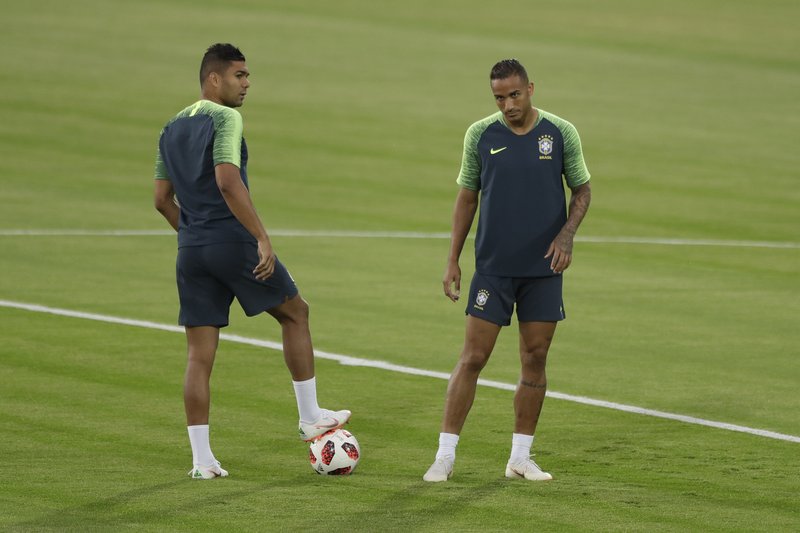 The Associated Press DANILO OUT: Brazil's Danilo, right, and Casemiro wait for the start of the official training session of the Brazil team prior to the quarter final match between Brazil and Belgium at the 2018 World Cup at Tsentralny stadium in Kazan, Russia, Thursday.