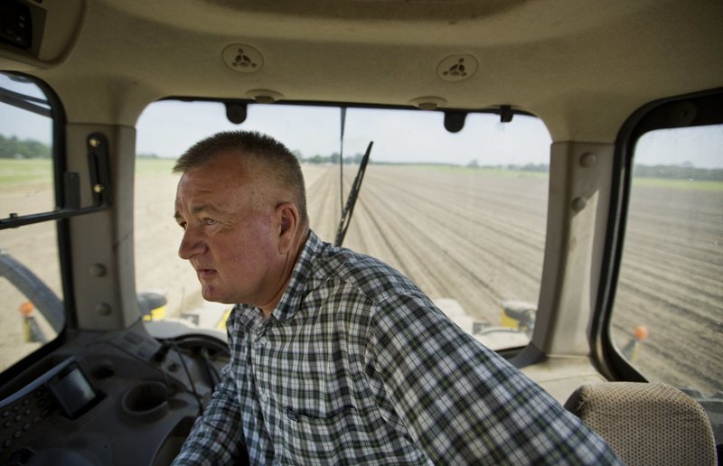 In this June 21, 2018, photo, Parrish Akins drives his tractor while planting cotton seeds on his farm in Nashville, Ga. Akins estimates that 50 percent of his cotton is exported out of the country, China being one of the main recipients. &#x201c;We&#x2019;re very concerned about tariffs,&#x201d; said Akins, who despite the potential effects on his business supports Trump&#x2019;s policy on tariffs. &#x201c;We&#x2019;ll suffer in the short term but the long term effects of fair trade will be positive for American agriculture and American industry.&#x201d; (AP Photo/David Goldman)