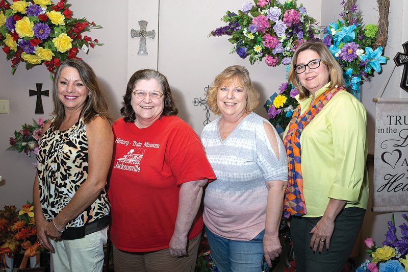 Members of the Jacksonville Historical District gather at Jacksonville Florist to plan for the annual Citizen of the Year Award Banquet to be held Thursday. From left are, Gina Crow, a member of the Jacksonville Historical District and the owner of Jacksonville Florist; Barbara Mashburn, CEO and secretary of the Jacksonville Historical District; Lida Feller, first chair of the district; and Laurie Johnson, a district member who is charge of public relations. 