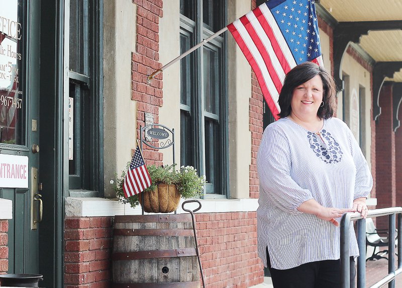 Jami Mullen stands outside the Russellville Depot, the historic downtown building where Main Street Russellville is located. Mullen is the new executive director of the nonprofit organization, and she and her husband are business owners in downtown Russellville, too. She said her goals include unifying stakeholders in downtown.