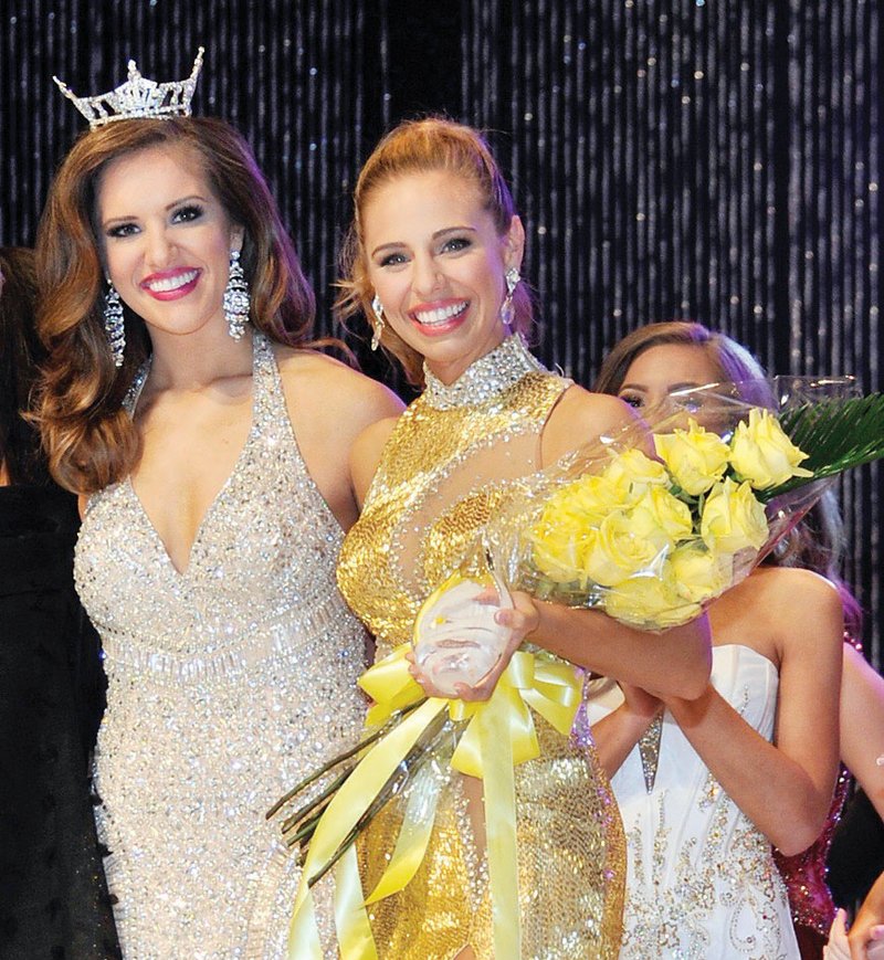 Miss Arkansas 2017 Maggie Benton of Jonesboro, left, congratulates Kelsey Stone of Russellville, who was named fourth runner-up in the 2018 Miss Arkansas Scholarship Pageant on June 16. Stone competed as Miss Natural State in the pageant.