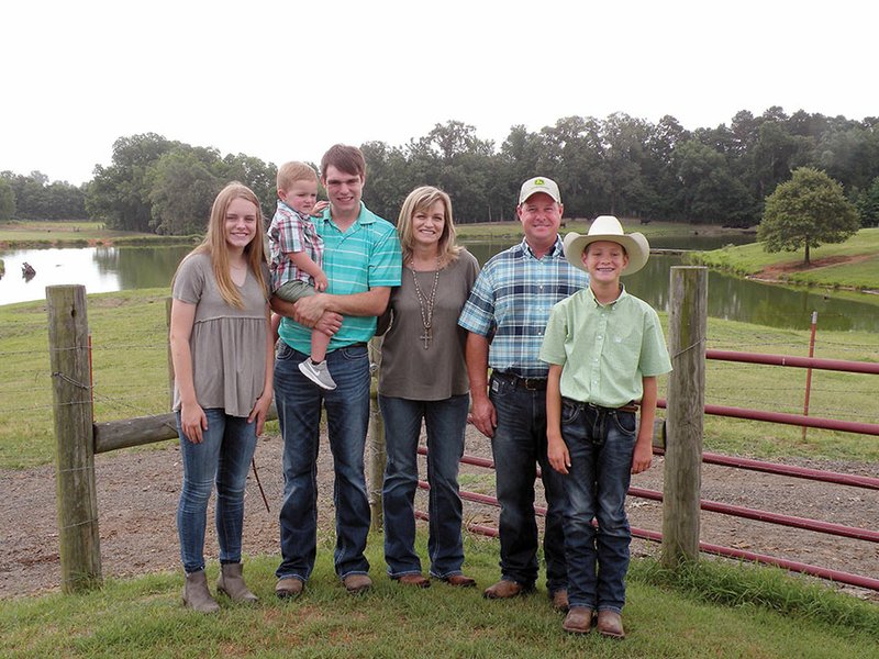 The Jason Trantina family of Bigelow has been named the 2018 Perry County Farm Family of the Year. Family members include, from left, Shannon Trantina; Ethan Horton and his 2-year-old son, Gage; Christy Trantina; Jason Trantina; and Joshua Trantina. In addition to their farm, the Trantinas also own and operate the Toad Suck One-Stop convenience store.