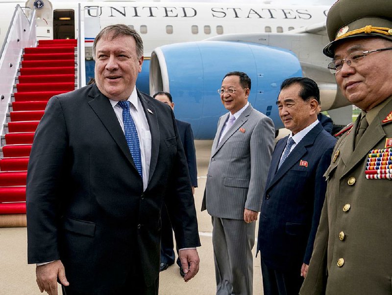 Secretary of State Mike Pompeo is greeted by North Korean officials Friday as he arrives at the airport in Pyongyang to “fill in some details” on commitments made at the Singapore summit. 
