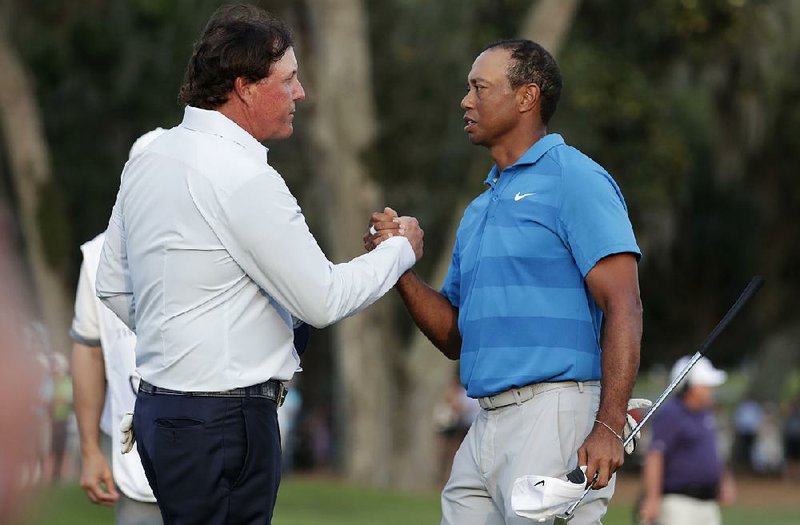 Phil Mickelson (left) and Tiger Woods are working on details for a one-on-one, $10 million, 18-hole match between the two. 