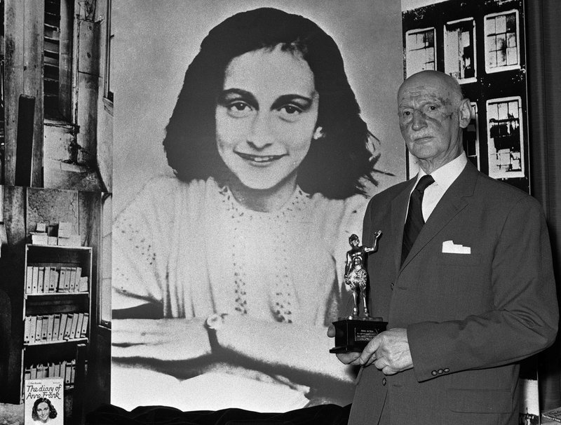 FILE - In this Monday, June 14, 1971 photo Dr. Otto Frank holds the Golden Pan award, given for the sale of one million copies of the famous paperback 'The Diary of Anne Frank' in London, Great Britain. New research suggests that the family of Anne Frank, the world-famous Jewish diarist who died in the Holocaust, attempted to immigrate to the United States and later also to Cuba, but their efforts were tragically thwarted by America&#x2019;s restrictive immigration policy, cumbersome bureaucracy and the outbreak of World War II. Only Otto Frank survived the holocaust. (AP Photo/Dave Caulkin, file)