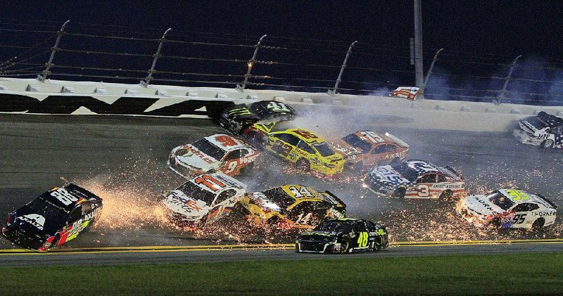 Several cars are involved in a crash on lap 54 of Saturday night’s NASCAR Monster Energy Cup Series race at Daytona International Speedway. The race was slowed by 11 cautions and only 13 of 40 starters were running at the finish.  