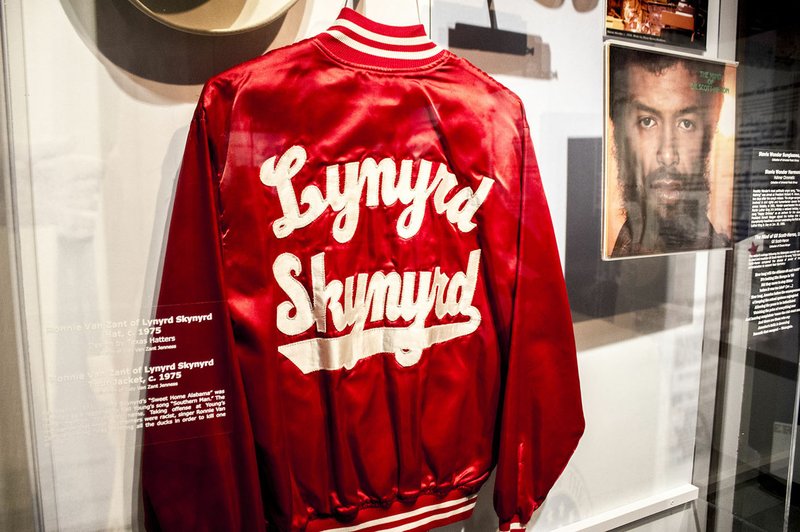 File Photo Rock legends' clothing -- much of it either loaned by artists or collectors for the exhibit or part of the Rock & Roll Hall of Fame's collection -- tells a portion of the story in "Louder Than Words." Handwritten lyrics to "Hands That Built America" written and signed by Bono and The Edge, birthday cards to President Bill Clinton from Bono, letters to members of Fleetwood Mac and signed memorabilia from band members have all been added to the displays to highlight the Clintons' personal connections to some of their favorite artists.