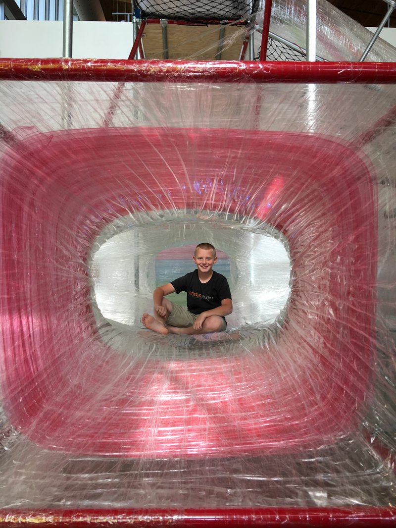 Courtesy Photo Eleven-year-old Collin Siebert helps beta test the "Tape and Tunnels" exhibit, one of three celebrating the third birthday of the Scott Family Amazeum.