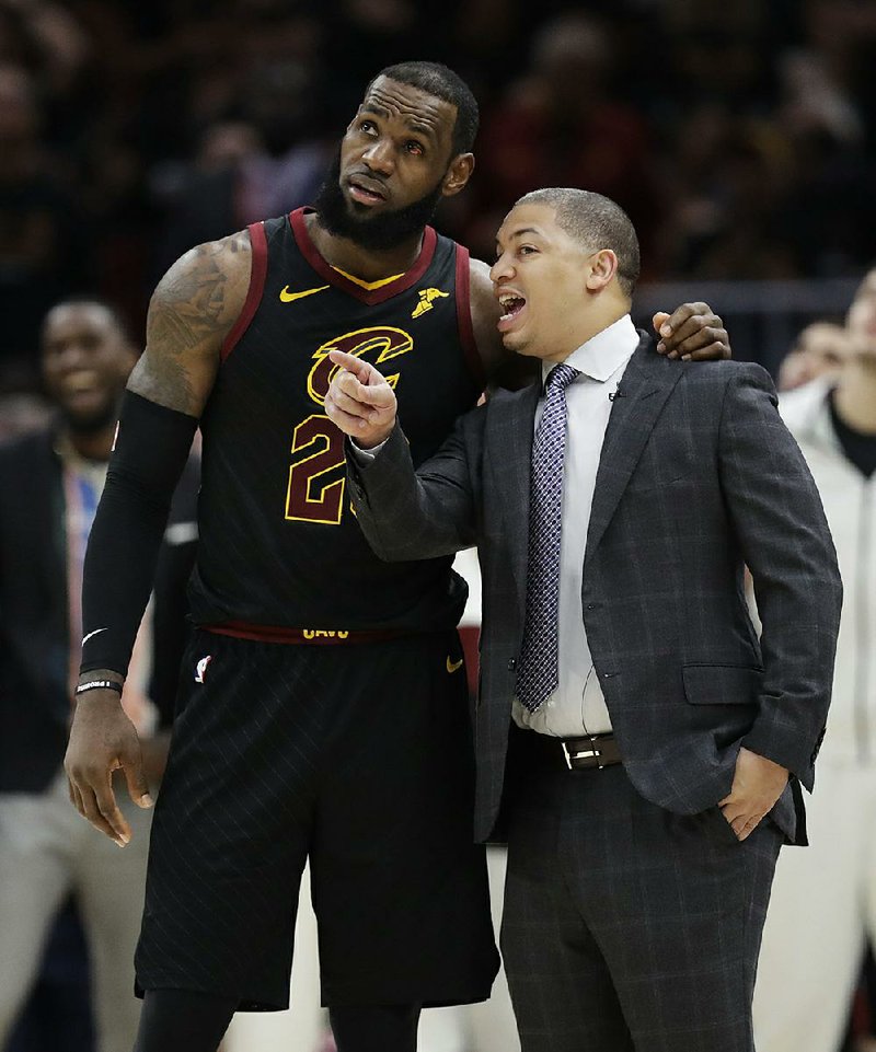 Cleveland Cavaliers Coach Tyronn Lue (right) plans to have dinner in the near future with Los Angeles Lakers Coach Luke Walton. New Laker LeBron James (left) is expected to be the major topic of discussion.