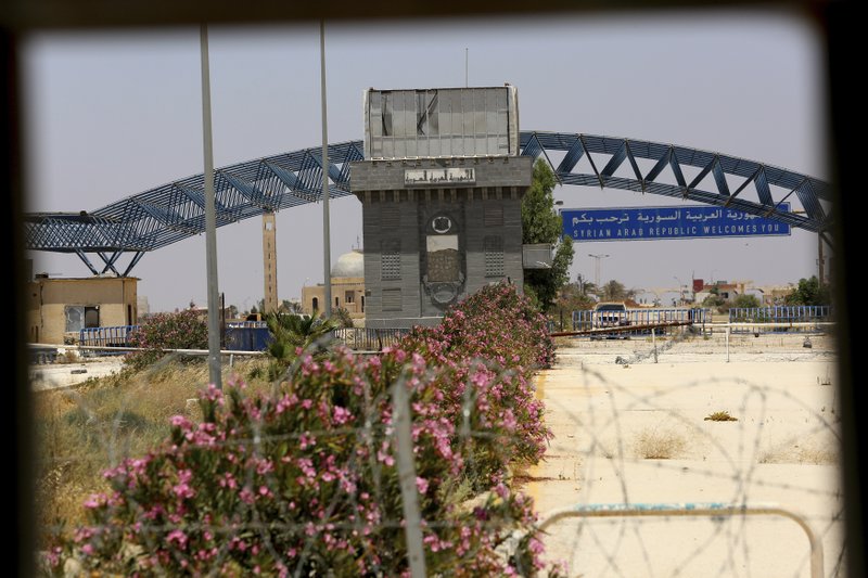 A view of the Syrian side of Naseeb crossing point with Jordan one day after Syrian army recovered southern territories of Daraa province from insurgents under a surrender deal mediated by Russia. Saturday, July 7, 2018.(AP Photo/Raad Adayleh)