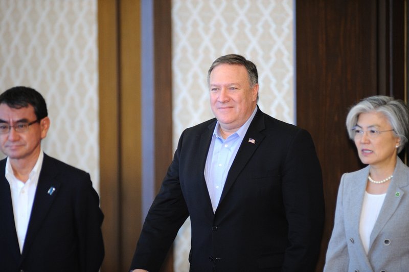 U.S. Secretary of State Mike Pompeo, center, Japan's Foreign Minister Taro Kono, left, and South Korea's Foreign Minister Kang Kyung-wha arrive their talk at the Iikura Guest House in Tokyo, Japan, Sunday, July 8, 2018. Pompeo is on a trip traveling to North Korea, Japan, Vietnam, Abu Dhabi, and Brussels. (David Mareuil/Pool Photo via AP)