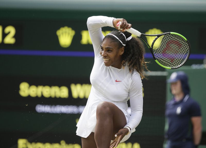 The Associated Press STUNNING RETURN: Serena Williams returns the ball to Evgeniya Rodina during their women's singles match Monday at the Championships, Wimbledon in London.