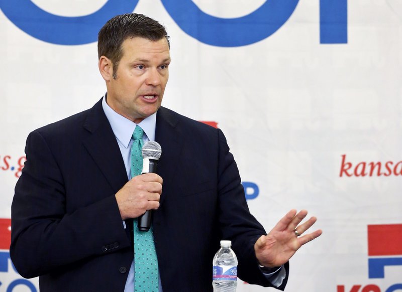 FILE - In this April 13, 2018, file photo, Kansas Secretary of State Kris Kobach gives an opening statement during the Republican gubernatorial debate in Atchison, Kan. A court filing on Sunday, July 8, 2018, asserts Kobach has complied with a court order finding the state's residents are not required to provide documentary proof of citizenship to register to vote, clearing the way for thousands of voters to more easily cast a regular ballot in the upcoming primary election. (Chris Neal/The Topeka Capital-Journal via AP, File)