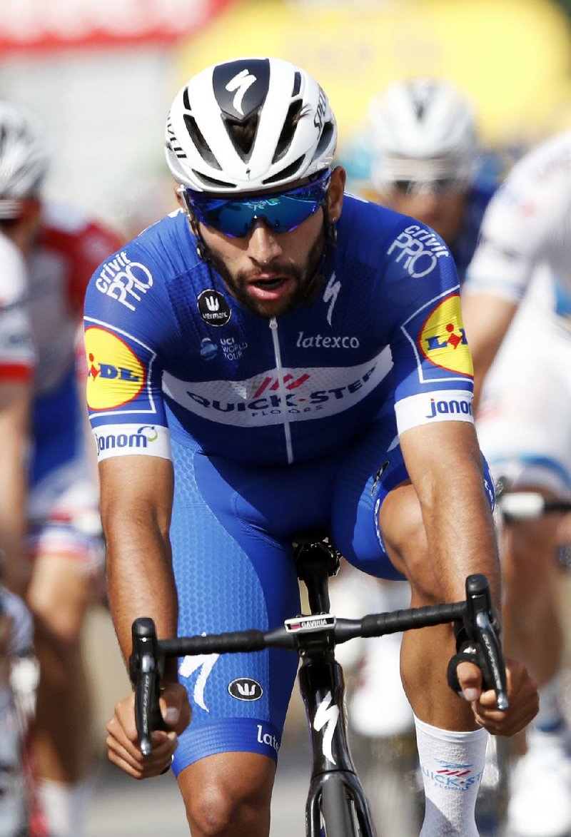 Colombia’s Fernando Gaviria crosses the finish line Tuesday in Sarzeau, France, to win the fourth stage of the Tour de France. Slovakia’s Peter Sagan was second and Germany’s Andre Greipel finished third. Belgium’s Greg Van Avermaet is the overall leader. 