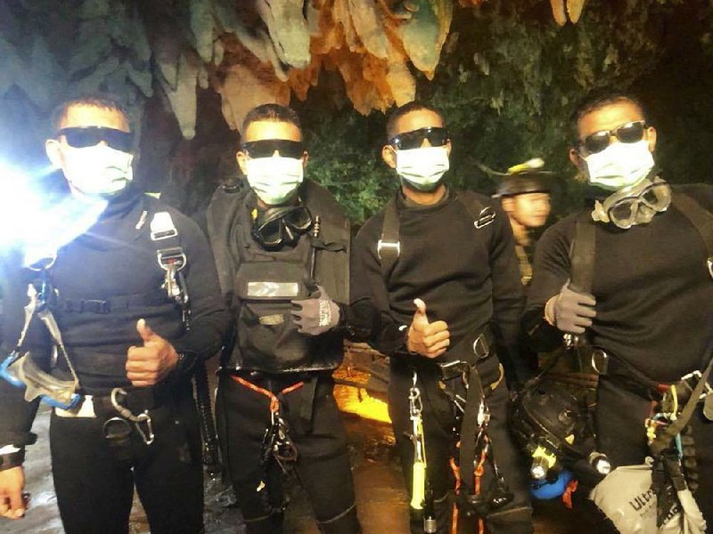 The last four Thai navy SEALs leave the Tham Luang cave complex after their rescue mission was completed. 