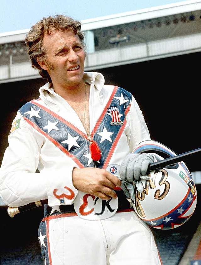 FILE PHOTO - In this Aug. 20, 1974, file photo, Evel Knievel poses at the Canadian national exhibition stadium in Toronto. Fifty years after Evel Knievel so famously wiped out trying to jump the fountain at Caesar's Palace, action sports wild man Travis Pastrana naiedl the stunt Sunday night, July 8, 2018, in the finale of a triple-header tribute to the late daredevil. (AP Photo/File)