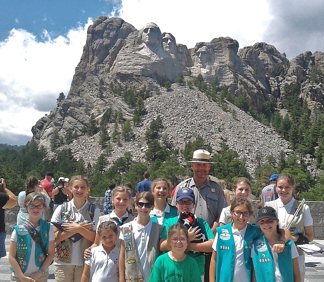 Courtesy Photo Girl Scout Troop 5340 is shown at Mount Rushmore, where they gave a presentation on properly folding the American flag.