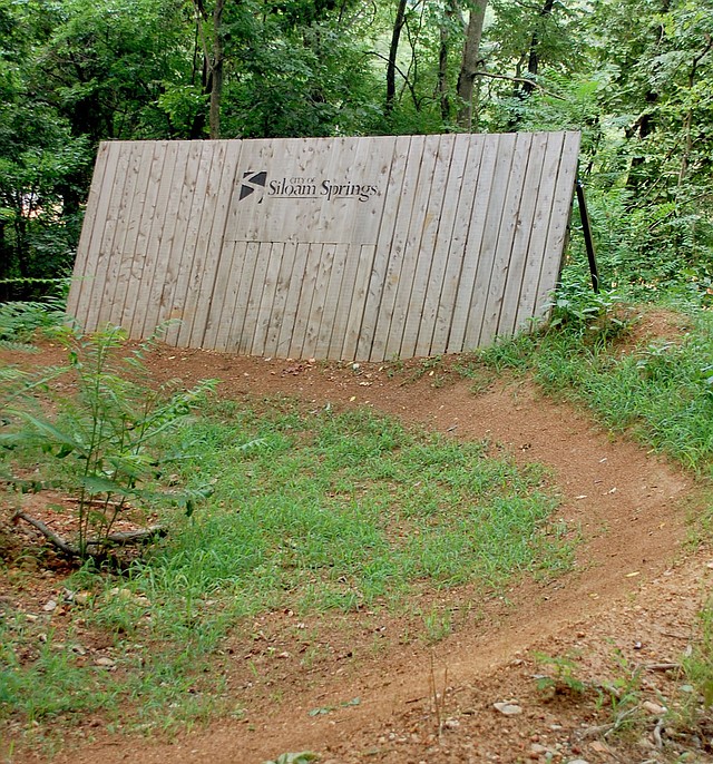 Hunter McFerrin/Herald-Leader For those capable of using them, this is one of several wall-ride features that exist on the mountain bike trails near city lake.