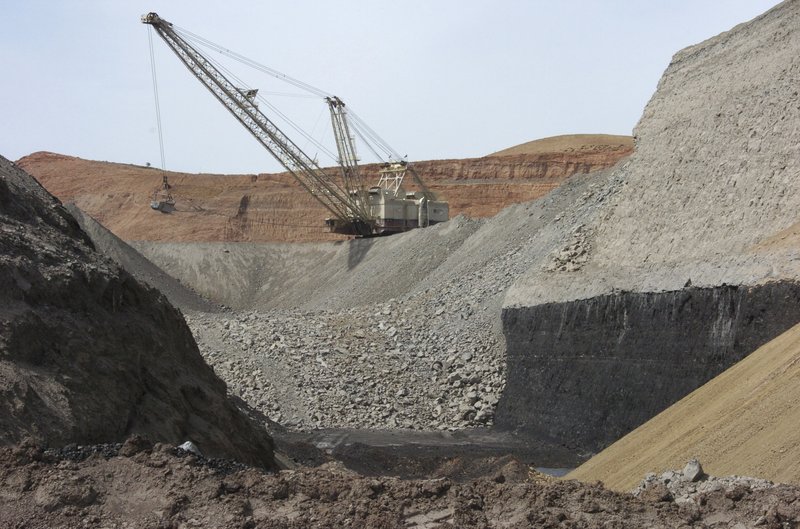 In this April 4, 2013, file photo, a dragline excavator moves rocks above a coal seam at the Spring Creek Mine in Decker, Mont. The Trump administration is advancing its plan to replace the centerpiece of President Barack Obama's efforts against global warming with a new rule expected to be more friendly to the coal industry. (AP Photo/Matthew Brown, File)