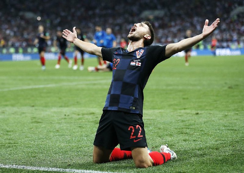 Croatia’s Josip Pivaric celebrates after Wednesday’s 2-1 extra-time victory over England on Wednesday in the World Cup semifinals at Moscow. Croatia will face France in the championship game Sunday. 