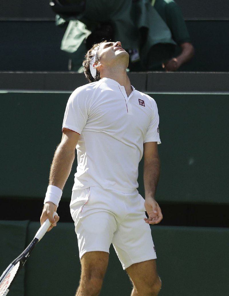 Top-seeded Roger Federer of Switzerland lost to No. 8 Kevin Anderson of South Africa 2-6, 6-7 (5), 7-5, 6-4, 13-11 at Wimbledon on Wednesday after being one point from a straight-set victory. 