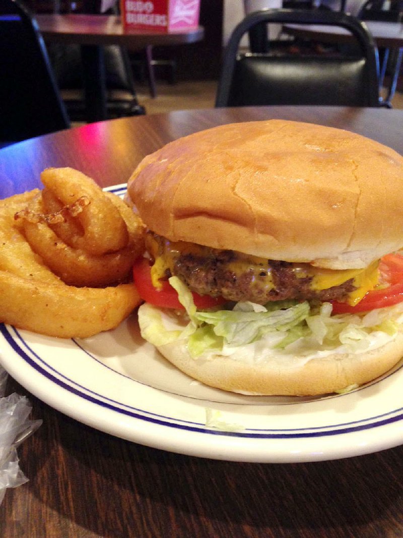 A cheeseburger and onion rings is a classic Sports Page lunch.