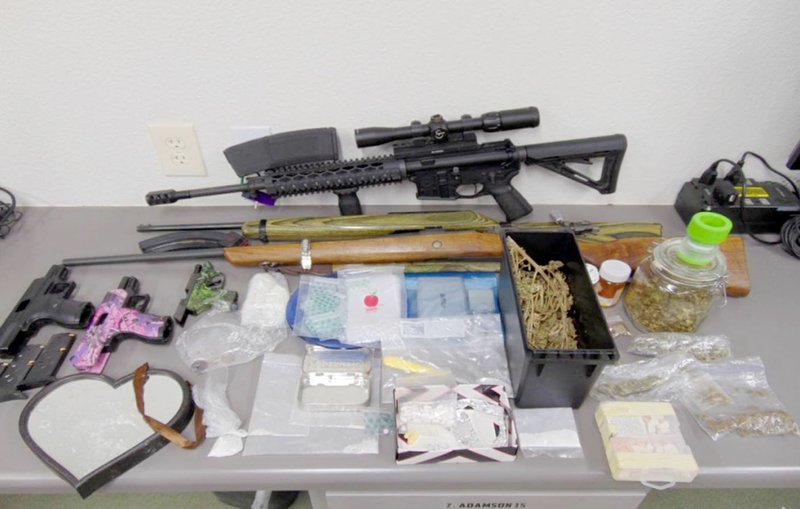 COURTESY PHOTO The controlled substances and paraphernalia pictured above were discovered while serving a search warrant on Narrows Lane, east of Noel, last week.