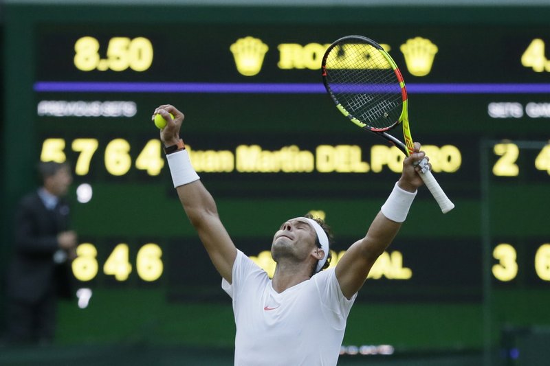 The Associated Press NADAL SURVIVES: Rafael Nadal celebrates defeating Juan Martin Del Potro in their men's quarterfinal match Wednesday at the Championships, Wimbledon in London.