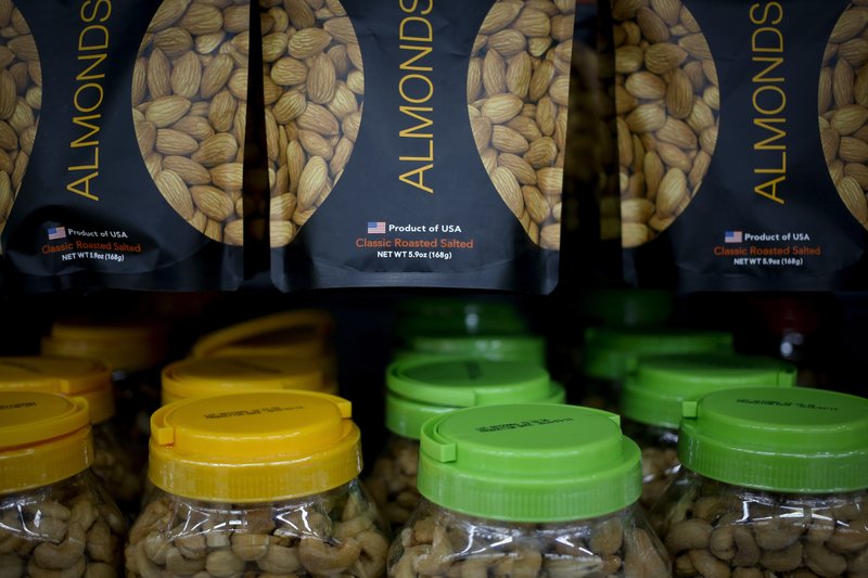 Imported nuts from the United States are displayed for sale at a hypermarket in Beijing, Wednesday, July 11, 2018. China's government has criticized the latest U.S. threat of a tariff hike as "totally unacceptable" and vowed to retaliate in their escalating trade war. The Commerce Ministry on Wednesday gave no details, but Beijing responded to last week's U.S. tariff hike on $34 billion of imports from China by increasing its own duties on the same amount of American goods. (AP Photo/Andy Wong)