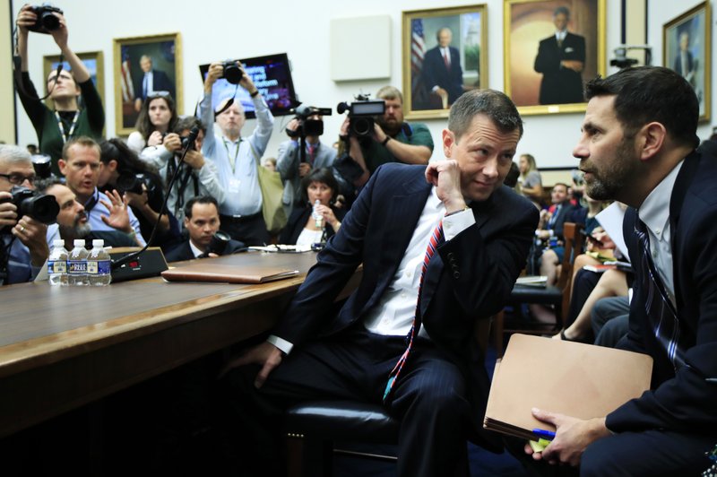 FBI Deputy Assistant Director Peter Strzok talks to an aide as he waits for the start of a joint hearing on, "oversight of FBI and Department of Justice actions surrounding the 2016 election" on Capitol Hill in Washington, Thursday, July 12. (AP Photo/Manuel Balce Ceneta)

