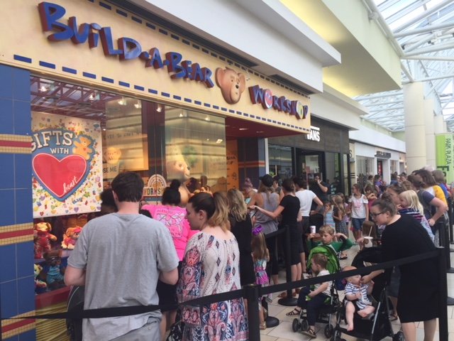 Hundreds of people lined up Thursday, July 12, 2018, in front of the Build-a-Bear workshop located in Little Rock's Park Plaza for the store's "pay your age" promotion. 