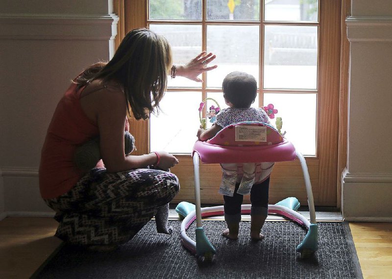 Within the walls of Salt Lake City’s First Unitarian Church, Honduran Vicky Chavez plays with her daughter Issabella. Chavez says seeing fellow Central Americans separated from their children at the U.S.-Mexico border makes her intent on trying to fight to stay in the United States where her entire family lives. 