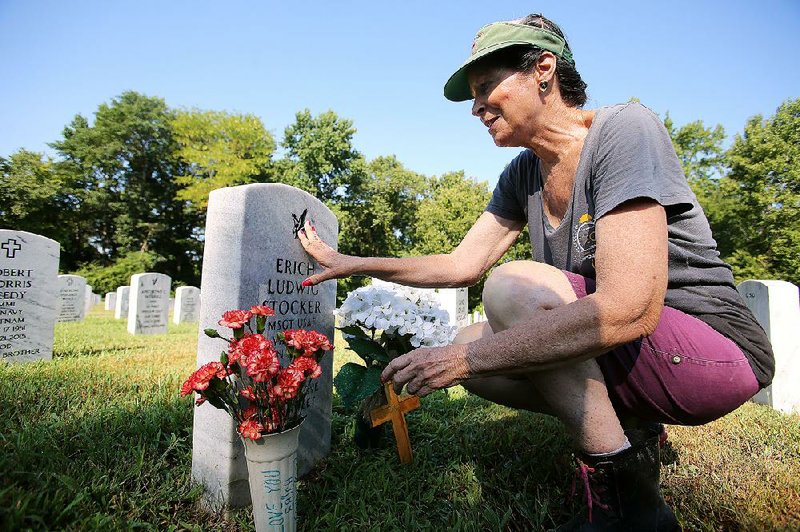 Arkansas Democrat-Gazette/THOMAS METTHE -- 7/12/2018 --
Francine Le Brant-Stocker visits the gravesite of her husband, retired Air Force Master Sgt. Erich L. Stocker, on Thursday, July 12, 2018, at the Arkansas State Veterans Cemetery at North Little Rock. Le Brant Stocker says she visits her husband's gravesite every week since he passed away two years ago, usually bringing fresh flowers when the weather allows in vases that she wrote "I Love You Erich" on. 