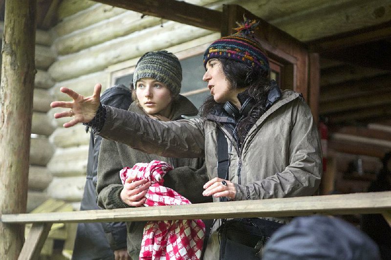 Director Debra Granik communicates with her star Thomasin McKenzie during the filming of Granik’s humanist drama Leave No Trace. 
