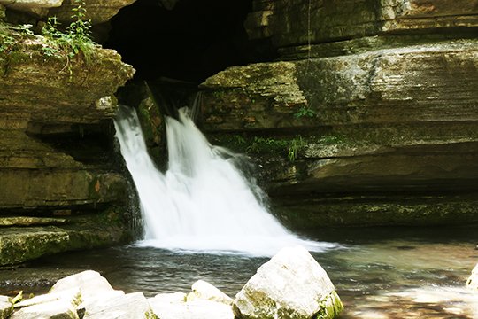 The Sentinel-Record/Corbet Deary HIDDEN CREEK: Visitors to Blanchard Springs Recreation Area can see where the creek feeding Mirror Lake pours from Blanchard Springs Caverns.