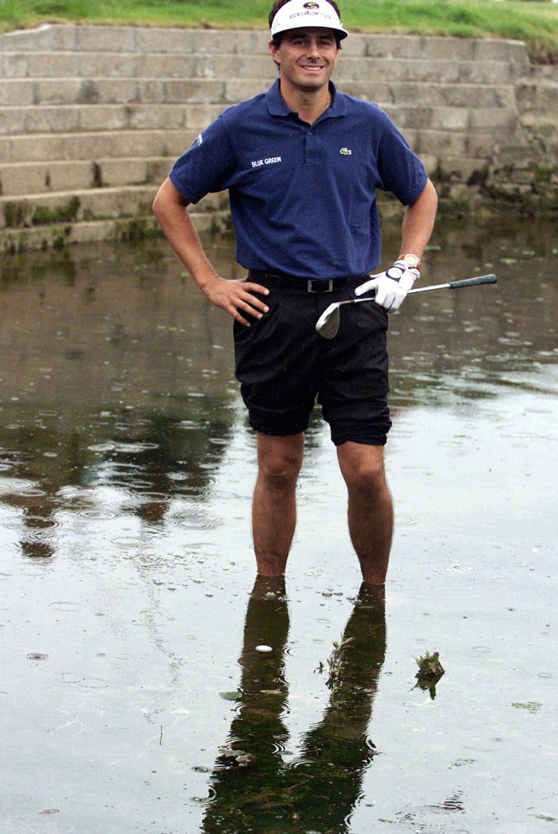 The Associated Press SOGGY LIE: France's Jean Van de Velde smiles as he stands in the water of the Barry Burn that crosses the 18th fairway on July 18, 1999, to see if his ball, bottom center, was playable during the final round of the 128th British Open Golf Championship at Carnoustie, Scotland. Carnoustie is known more for the calamity it causes than the British Open champions it produces, including the most famous collapse of all by Van de Velde.