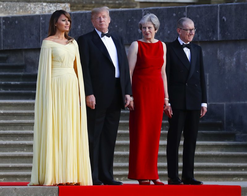 From left, first lady Melania Trump, President Donald Trump, British Prime Minister Theresa May, and her husband Philip May, watch the arrival ceremony at Blenheim Palace, Oxfordshire, Thursday, July 12, 2018. (AP Photo/Pablo Martinez Monsivais)