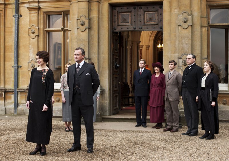 This undated publicity photo provided by PBS shows, from left, Elizabeth McGovern as Lady Grantham, Hugh Bonneville as Lord Grantham, Dan Stevens as Matthew Crawley, Penelope Wilton as Isobel Crawley, Allen Leech as Tom Branson, Jim Carter as Mr. Carson, and Phyllis Logan as Mrs. Hughes, from the TV series, "Downton Abbey." (AP/PBS, Carnival Film & Television Limited 2012 for MASTERPIECE, Nick Briggs)