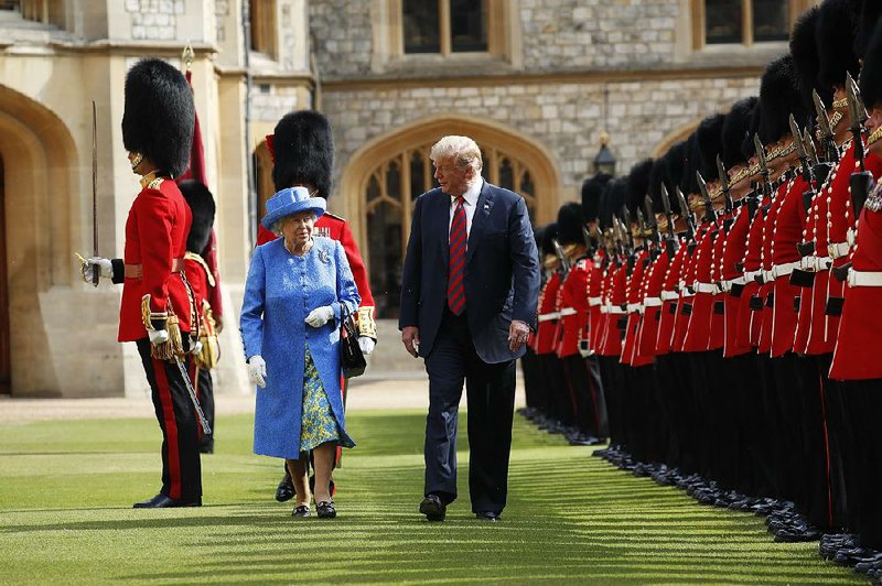 President Donald Trump and Queen Elizabeth II inspect the troops on Friday at Windsor Castle. Trump’s audience with the queen closed out his two-day visit to England.  