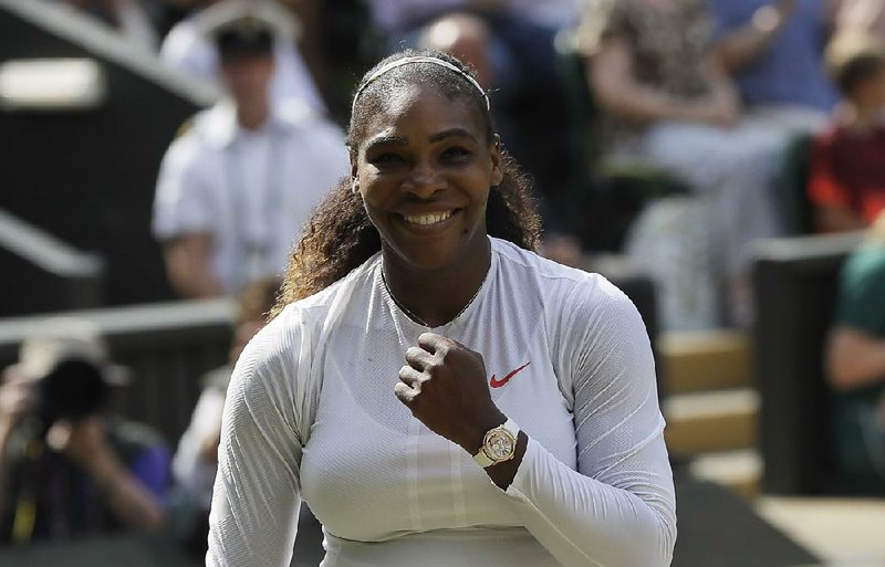 Serena Williams of the United States celebrates defeating Germany's Julia Gorges in their women's singles semifinals match at the Wimbledon Tennis Championships, in London, Thursday July 12, 2018.