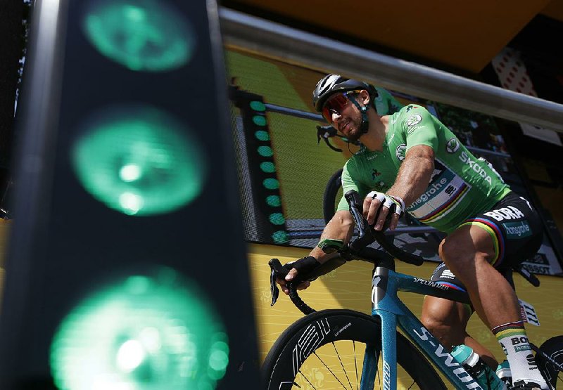 Slovakia’s Peter Sagan, wearing the best sprinter’s green jersey, arrives for the start of the seventh stage of the Tour de France on Friday. Sagan, the three-time reigning world champion, said it was a boring stage. 