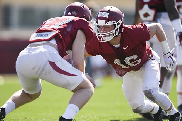 Arkansas linebacker Bumper Pool (16) goes through practice Saturday, March 3, 2018, in Fayetteville. 