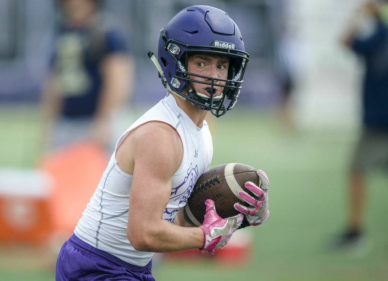 NWA Democrat-Gazette/CHARLIE KAIJO Fayetteville wide receiver Connor Flannigan runs the ball during the Southwest Elite 7on7 tournament, Friday, July 13, 2018 at Harmon Stadium in Fayetteville.